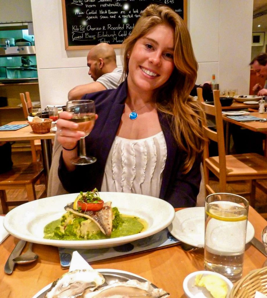 girl with white wine in a restaurant