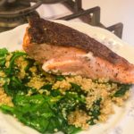 salmon over spinach and quinoa stir fry