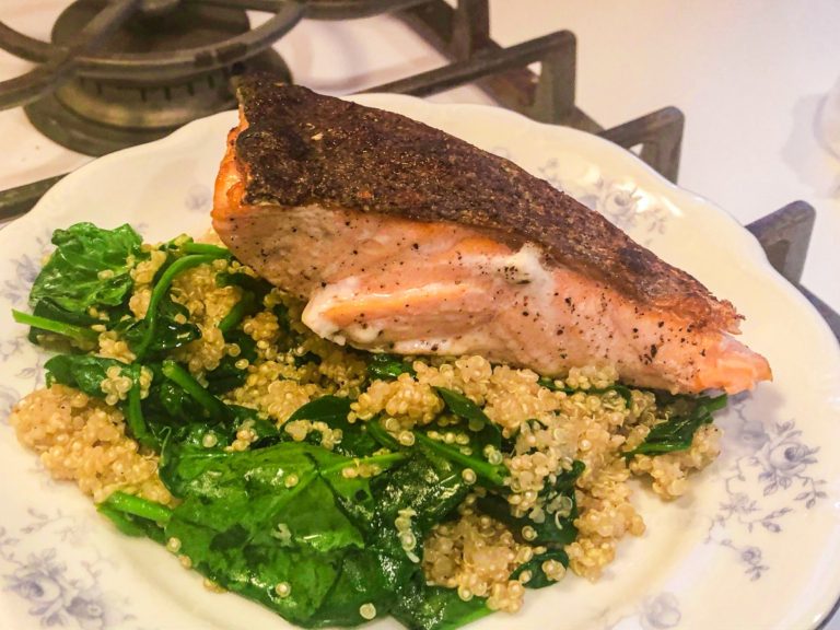 salmon over spinach and quinoa stir fry