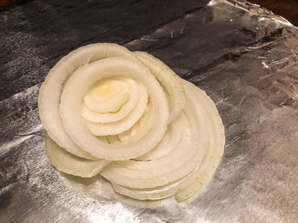 onion rings on top of rice and tinfoil