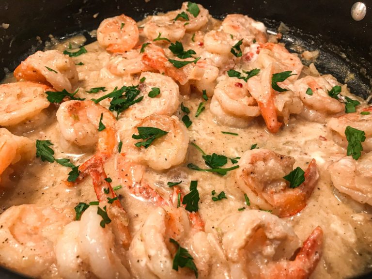 shrimp in creamy sauce in black pan