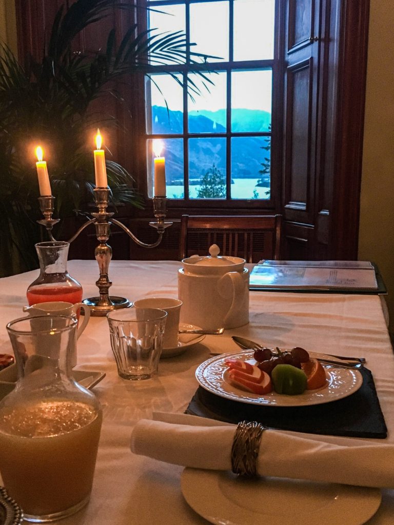 dining table with fruit plate overlooking window scene