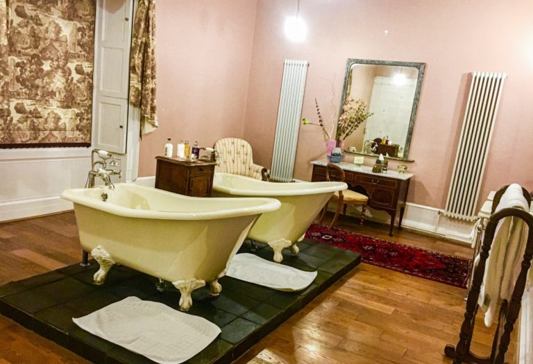 two claw foot tubs in bathroom