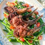 grilled lamb chops over green beans and cherry tomatoes