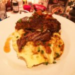 short ribs resting on mashed potatoes