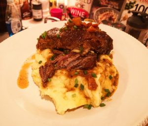 short ribs resting on mashed potatoes