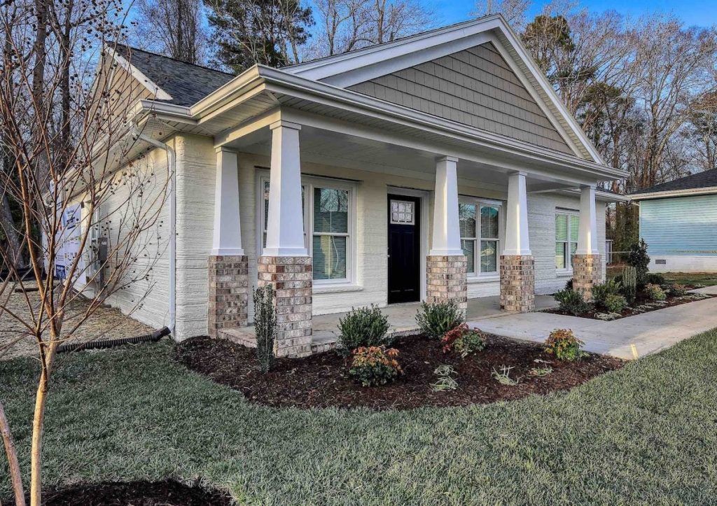 house with porch on grass